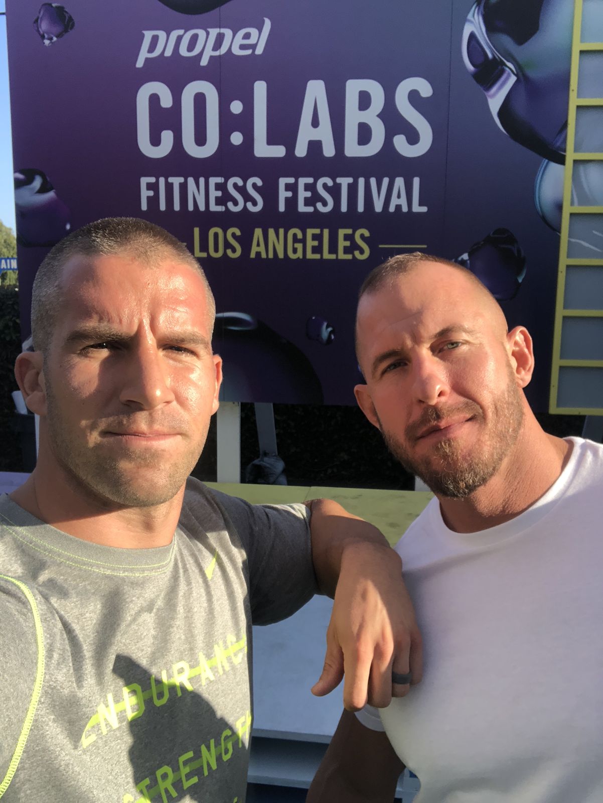 Grant Weeditz taking a selfie in front of the CO:LABS Los Angeles banner